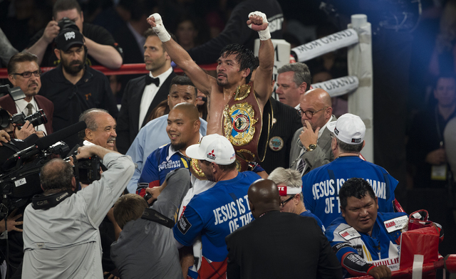 Manny Pacquiao celebrates after defeating Timothy Bradley during the international WBO welterweight championship at the MGM Grand Garden Arena, Saturday, April 9, 2016, in Las Vegas. (Benjamin Hag ...