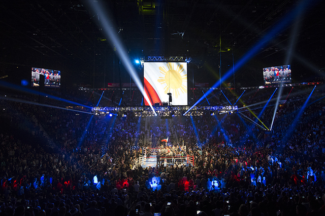 The Filipino National Anthem is performed before the start of the international WBO welterweight championship between Manny Pacquiao and Timothy Bradley at the MGM Grand Garden Arena, Saturday, Ap ...