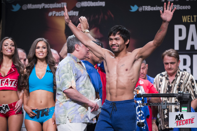 Manny Pacquiao poses on stage during a weigh-in at the MGM Grand Garden Arena on Friday, April 8, 2016, in Las Vegas. Pacquiao will fight for a third time against Timothy Bradley tomorrow night. E ...