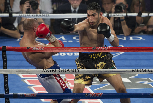 Gilberto Ramirez connects on punch against Arthur Abraham during the international WBO super middleweight championship at the MGM Grand Garden Arena, Saturday, April 9, 2016, in Las Vegas. Benjami ...