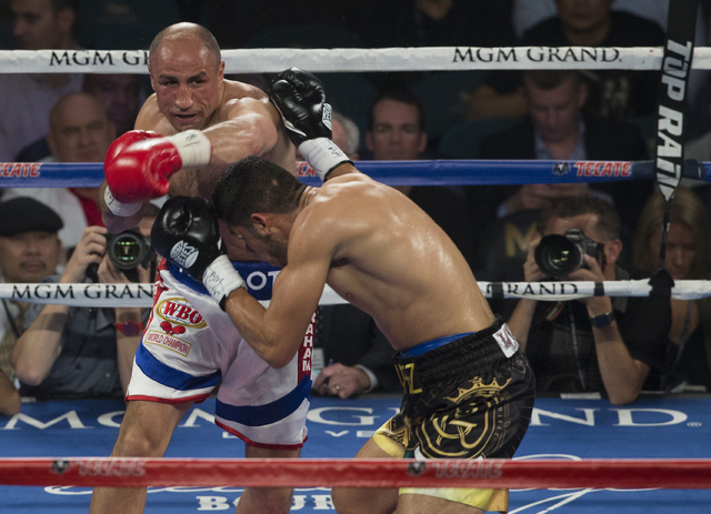 Arthur Abraham connects on punch against Gilberto Ramirez during the international WBO super middleweight championship at the MGM Grand Garden Arena, Saturday, April 9, 2016, in Las Vegas. Benjami ...