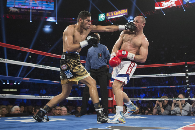 Gilberto Ramirez, left, connects a left punch against Arthur Abraham in the WBO International welterweight championship boxing bout at the MGM Grand Garden Arena on Saturday, April 9, 2016, in Las ...