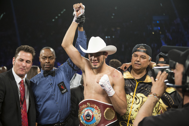 Gilberto Ramirez celebrates his victory against Arthur Abraham in the WBO International welterweight championship boxing bout at the MGM Grand Garden ArenaSaturday, April 9, 2016, in Las Vegas, Er ...