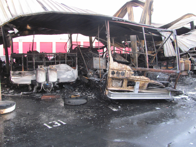 The shell of a motor home, right, sits next to a trailer reduced to a frame and two propane tanks following a fire at the Storage at Summerlin business on West Lake Mead Boulevard on Saturday, Apr ...