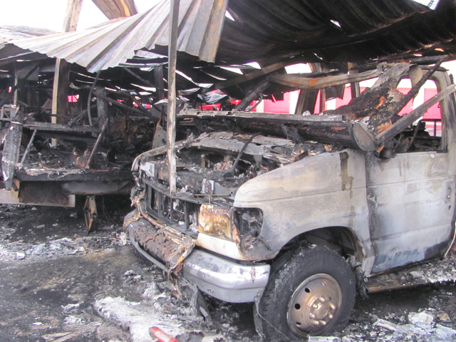 An RV destroyed in a fire sits under a warped metal awning at the Storage at Summerlin business on West Lake Mead Boulevard on Saturday, April 9, 2016. The fire damaged or destroyed 37 boats, RVs, ...
