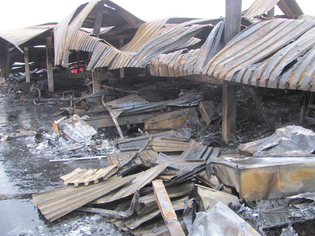 Little remains of the boats and vehicles under a metal awning following a fire at the Storage at Summerlin business on West Lake Mead Boulevard on Saturday, April 9, 2016. The fire damaged or dest ...