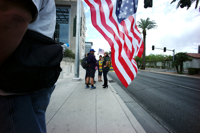 People protest outside of the Lloyd George Federal Building ahead of an arraignment for Ammon and Ryan Bundy, among others, in Las Vegas on Friday, April 15, 2016. (Chase Stevens/Las Vegas Review- ...