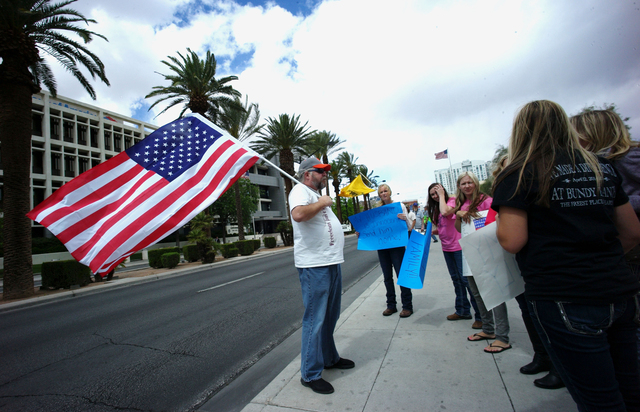 People, including Doug Knowles of Pahrump, left, protest outside of the Lloyd George Federal Building ahead of an arraignment for Ammon and Ryan Bundy, among others, in Las Vegas on Friday, April  ...
