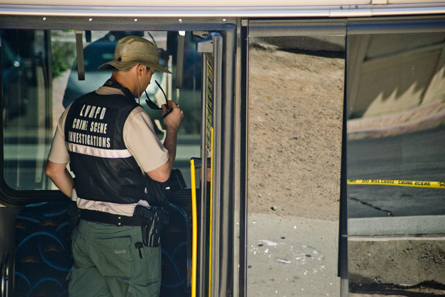 A crime scene investigator enters an RTC bus that was involved in a collision with a pickup truck at the corner of Sahara Avenue and McLeod Drive in Las Vegas Sunday, April 17, 2016. Daniel Clark/ ...