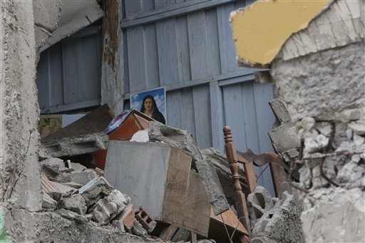 A destroyed house is seen in Pedernales, Ecuador, Sunday, April 17, 2016. A magnitude-7.8 quake, the strongest since 1979, hit Ecuador flattening buildings, buckling highways along its Pacific coa ...
