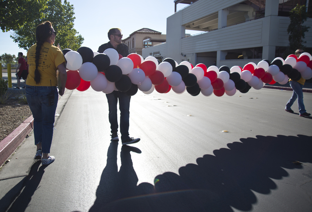 Volunteers help to move a balloon arch during the 26th annual Aid for AIDS of Nevada (AFAN) AIDS Walk Las Vegas at Town Square in Las Vegas on Sunday, April 17, 2016. (Daniel Clark/Las Vegas Revie ...