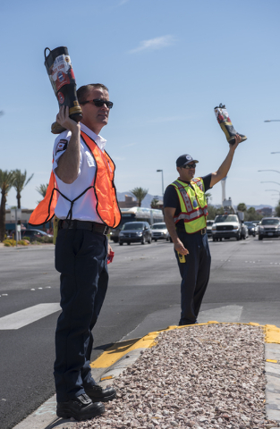 EMS Field Coordinator Scott Phillips, left, and Fire Engineer Kurt Bacca, greets motorists to collect donations for the annual "Fill the Boot" drive that benefits the Muscular Dy ...
