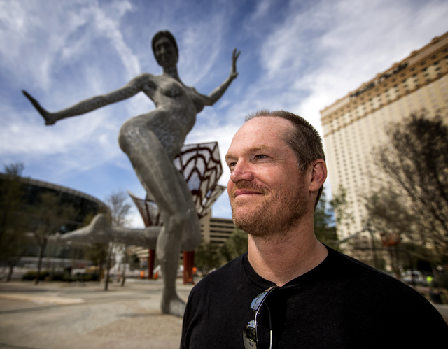 Bliss Dance stands beside his piece Bliss Dance i during an unveiling at The Park, MGM Resorts Internationalճ outdoor dining and entertainment district, on Friday, March 4, 2016. The 40-foot ...