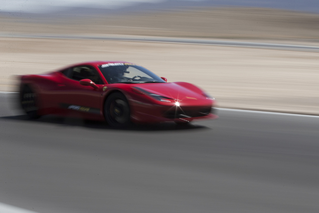 A driver takes a lap in a Ferrari 458 Italia during the ceremonial track opening for SPEEDVEGAS on Friday, April 15, 2016, in Las Vegas. (Erik Verduzco/Las Vegas Review-Journal Follow @Erik_Verduzco)
