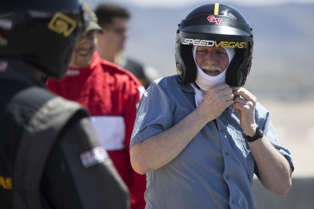 Mike Lee takes off his helmet after taking a lap in an exotic car during the ceremonial track opening for SPEEDVEGAS on Friday, April 15, 2016, in Las Vegas. (Erik Verduzco/Las Vegas Review-Journa ...