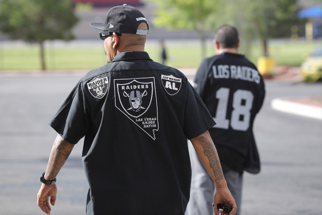 Raiders fans wait for the arrival of Oakland Raiders owner Mark Davis during a Southern Nevada Tourism Infrastructure Committee meeting at UNLV in Las Vegas on Thursday, April 28, 2016. (Brett Le  ...