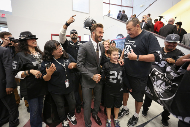 David Beckham poses for a photo with Oakland Raiders fans during a Southern Nevada Tourism Infrastructure Committee meeting at UNLV in Las Vegas on Thursday, April 28, 2016. (Brett Le Blanc/Las Ve ...