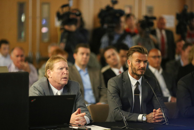 David Beckham, right, and Oakland Raiders owner Mark Davis, left, speak with the Southern Nevada Tourism Infrastructure Committee about a multi-use stadium during a meeting at UNLV in Las Vegas on ...