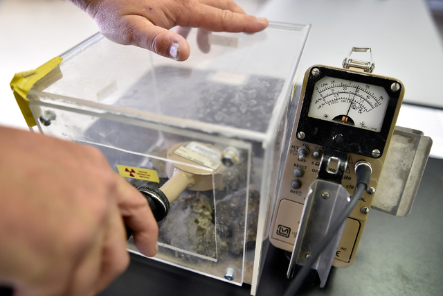 Brian Richardson, operation support supervisor, demonstrates using survey equipment with a sample of radioactive material collected from the 1955 Apple-2 nuclear blast bomb site. (David Becker/Las ...