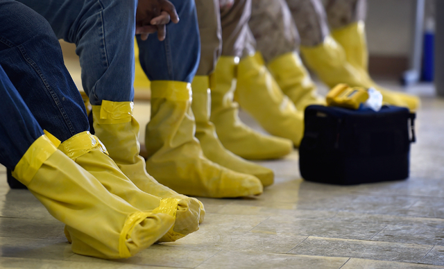 Students wearing protective footwear sit as they review procedures before field work at the Counter-Terrorism Operations Support training facility at the Nevada National Security Site on Wednesday ...