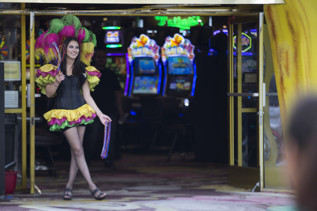 Hostess Mildred Marissa Herrera stands in front of Mermaids casino at the Fremont Street Experience on Thursday, April 21, 2016, in Las Vegas. The owners of the D Las Vegas and Golden Gate purchas ...