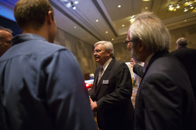Desert Research Institute President Stephen Wells talks with attendees during an event honoring 2016 DRI Nevada Medalist Dr. Mary "Missy" Cummings at the Aria hotel-casino in Las Vegas on Thursday ...