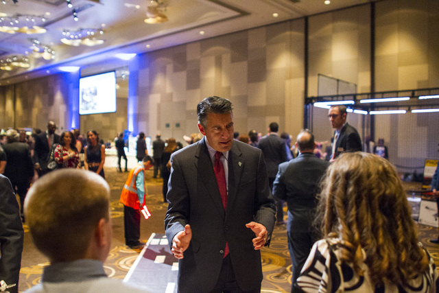 Gov. Brian Sandoval speaks with students from Sandy Miller Elementary School during an event honoring 2016 DRI Nevada Medalist Dr. Mary "Missy" Cummings at the Aria hotel-casino in Las Vegas on Th ...
