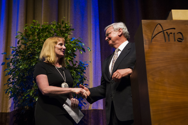 Desert Research Institute President Stephen Wells congratulates 2016 DRI Nevada Medalist Dr. Mary "Missy" Cummings during an event honoring Cummings at the Aria hotel-casino in Las Vegas on Thursd ...