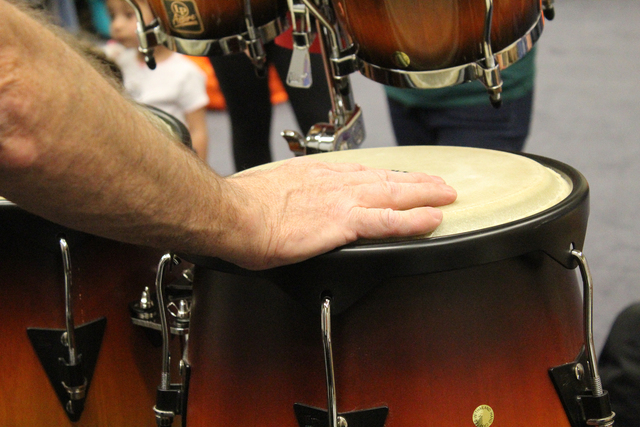 Brian Gardner puts his hand on the congas and starts playing at a drum circle at the Green Valley Library, 2797 N. Green Valley Parkway April 2. Michael Lyle/View