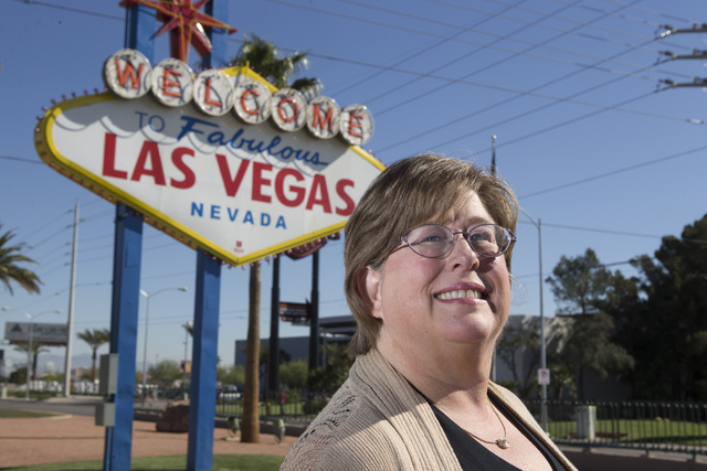 Lisa Lynn Chapman, communications coordinator for the Nevada Network Against Domestic Violence, poses for a portrait at the Welcome to Fabulous Las Vegas sign on S. Las Vegas Boulevard on Tuesday, ...