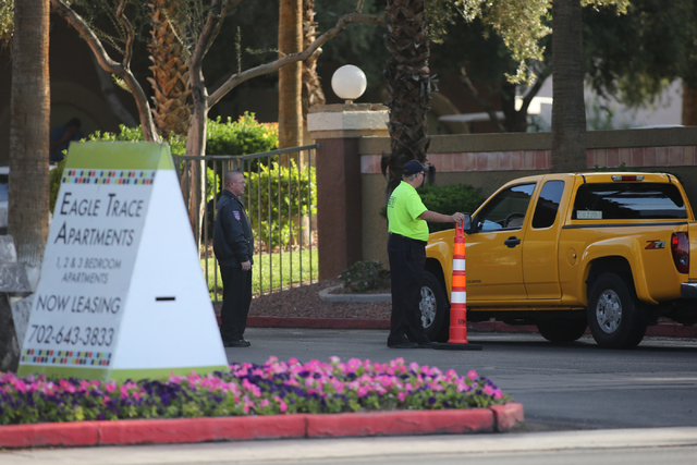 Security guards screen cars as they enter Eagle Trace Apartments near Nellis Air Force Base in northeast Las Vegas on Friday, April 22, 2016. Metro is investigating a fatal shooting at an apartmen ...