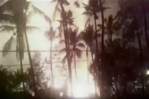 In this image made from video, a flash from an explosion is seen from the ground during a fireworks show at a temple in Kollam, in the southern Indian state of Kerala, early Sunday, April 10, 2016 ...