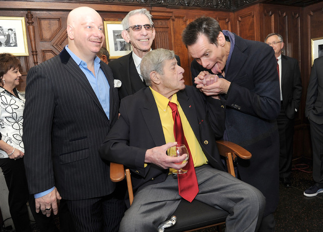 Jeff Ross,from left, Richard Belzer, and Jim Carrey, right, joke with entertainer Jerry Lewis at the Friars Club before his 90th birthday celebration on Friday, April 8, 2016, in New York. (Brad B ...