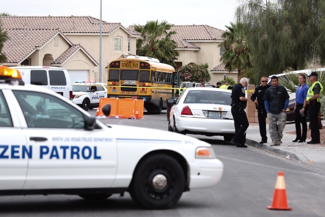 Law enforcement officials work at the scene in North Las Vegas, where a bus accident killed a toddler on Thursday, April 14, 2016. (Jeff Scheid/Las Vegas Review Journal)