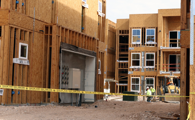Yellow crime scene tape is seen at a construction site where a security guard was found dead by Las Vegas police in the 5100 block of Jerry Tarkanian Way on Wednesday, April 27, 2016. (Bizuayehu T ...