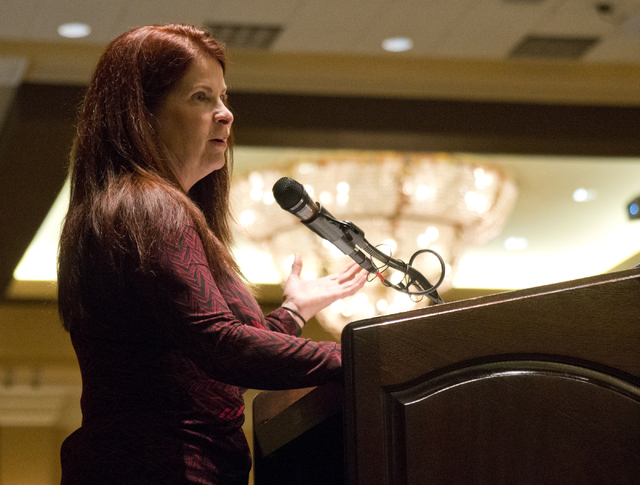 Henderson City Councilwoman Debra March speaks about a bill aimed at decreasing the number of squatters living in vacant homes during the Greater Las Vegas Association of Realtors general membersh ...
