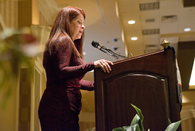 Henderson City Councilwoman Debra March speaks about a bill aimed at decreasing the number of squatters living in vacant homes during the Greater Las Vegas Association of Realtors general membersh ...