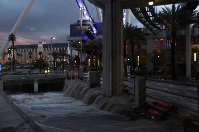 Water drains into a flood tunnel behind the Linq in Las Vegas on Saturday, April 9, 2016. (Brett Le Blanc/Las Vegas Review-Journal)