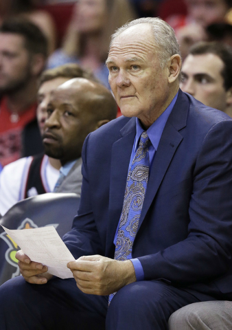 Sacramento Kings coach George Karl watches the action during the second half of the team's NBA basketball game against the Houston Rockets on Wednesday, April 13, 2016, in Houston. The Rockets won ...