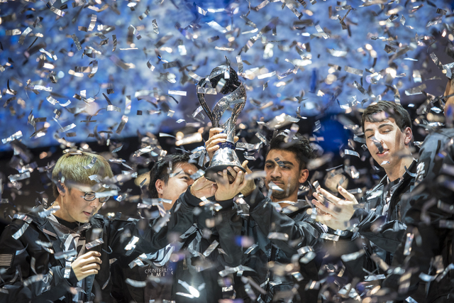 Counter Logic Gaming celebrates after defeating TSM during the North America League of Legends Championship Series Spring Final at the Mandalay Bay Event Center in Las Vegas on Sunday, April 17, 2 ...