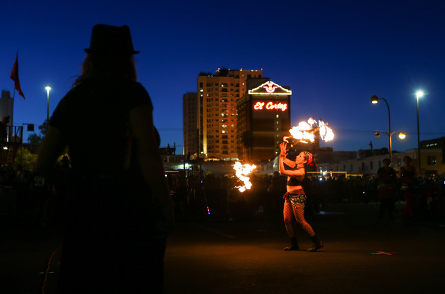A member of Flameology performs before the start of the Life Cube fire ceremony in downtown Las Vegas on Saturday, April 2, 2016. (Chase Stevens/Las Vegas Review-Journal) Follow @csstevensphoto