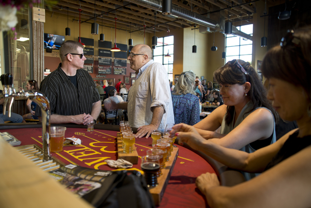 From left, Michael Morgan, John Slyman, Yumi Morgan, and Hidemi Slyman talk during the grand opening of Lovelady Brewery and Taproom in downtown Henderson on Friday, April 1, 2016. (Daniel Clark/L ...