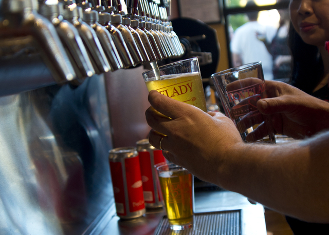 Richard Lovelady draws a beer rom a tap during the grand opening of Lovelady Brewery and Taproom in downtown Henderson on Friday, April 1, 2016. (Daniel Clark/Las Vegas Review-Journal) Follow @Dan ...