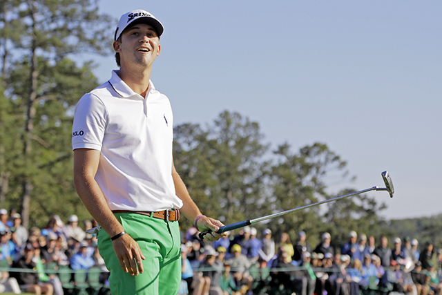 Smylie Kaufman reacts after missing a putt on the 18th green during the third round of the Masters golf tournament Saturday, April 9, 2016, in Augusta, Ga. (AP Photo/Jae C. Hong)