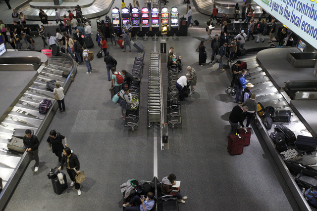 Travelers wait for their luggage in the baggage claim area at the McCarran International Airport Tuesday, March 22, 2016 in Las Vegas. Rachel Aston/Las Vegas Review-Journal Follow @rookie__rae