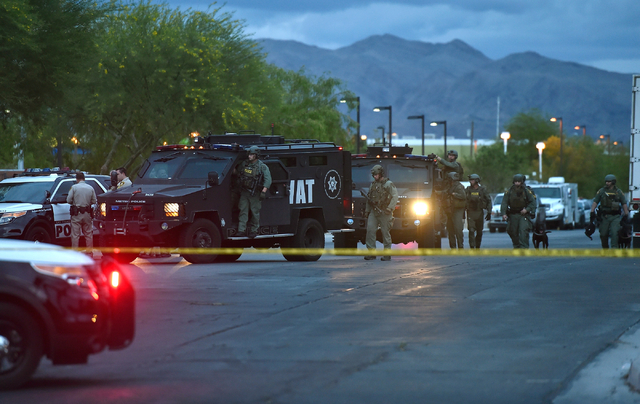 The Las Vegas Metro SWAT team moves outside the North East Area Command as they deal with a situation inside their station along Cecile Avenue Friday, April 8, 2016, in Las Vegas.  (David Becker/L ...