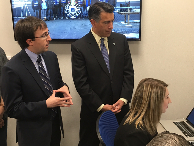 Gov. Brian Sandoval gets a demonstration of the new lab from UNR robotics professor Richard Kelley and UNR student Camille Bourquin on Wednesday, April 6, 2016. Sean Whaley/Las Vegas Review-Journal