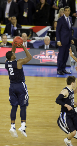 Villanova's Kris Jenkins (2) shoots a game winning three point basket in the closing seconds of the NCAA Final Four tournament college basketball championship game against North Carolina, Monday,  ...