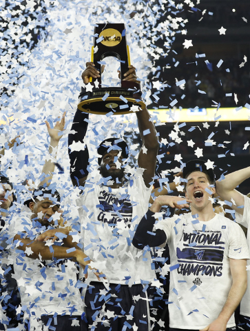Villanova players celebrate after the NCAA Final Four tournament college basketball championship game against North Carolina, Monday, April 4, 2016, in Houston. Villanova won 77-74. (AP Photo/Davi ...