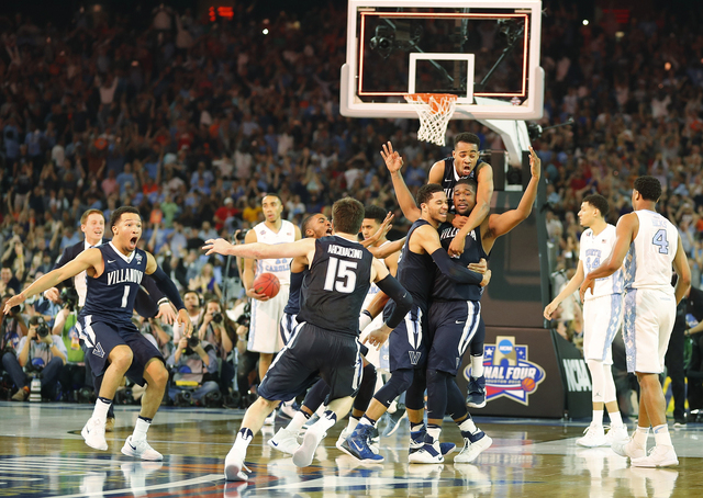 Villanova players celebrate after the NCAA Final Four tournament college basketball championship game against North Carolina, Monday, April 4, 2016, in Houston. Villanova won 77-74. (AP Photo/Kii ...